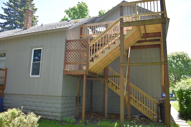 rear view of house featuring a deck