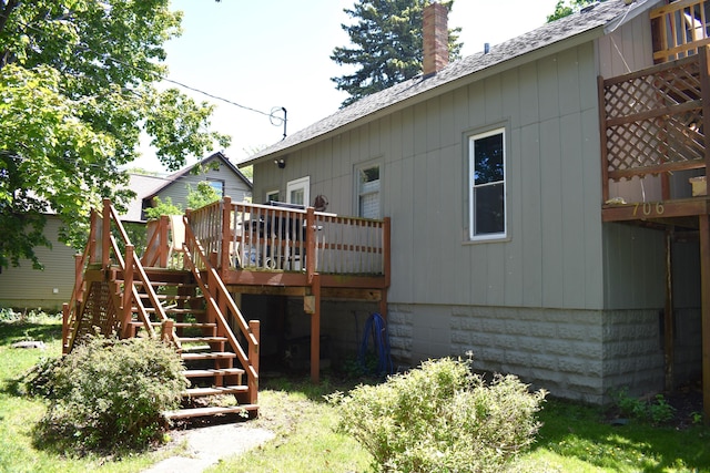 back of house with a wooden deck