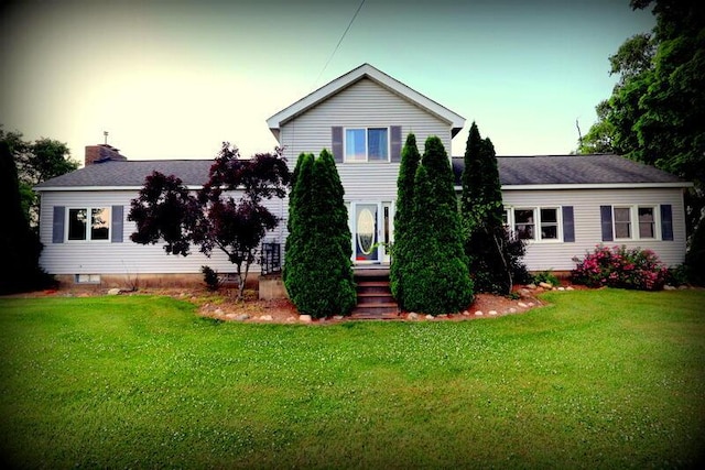 view of front of home with a lawn