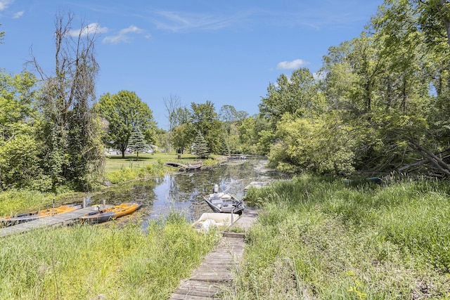 exterior space with a boat dock and a water view