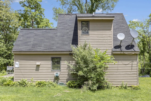 rear view of house with a lawn