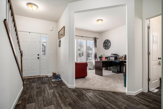 entrance foyer with dark hardwood / wood-style flooring