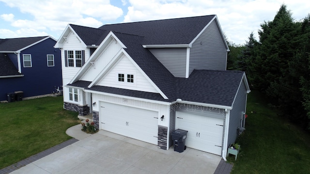 view of front of home featuring a garage and a front lawn