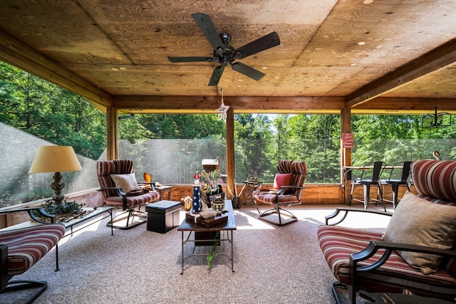 view of patio with ceiling fan and an outdoor fire pit