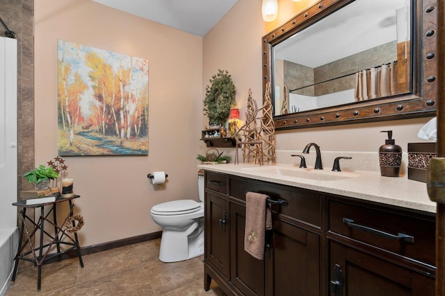 bathroom with vanity, toilet, and curtained shower