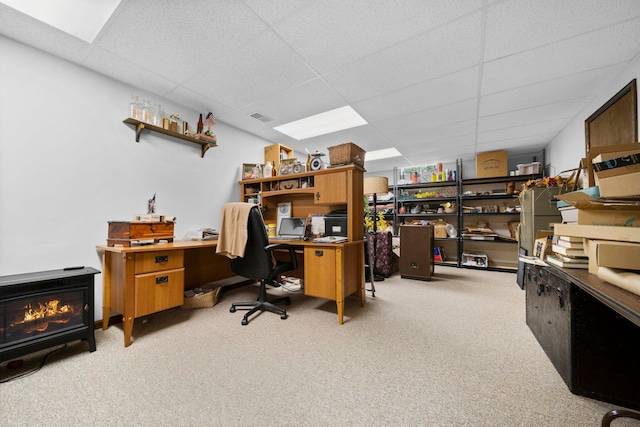 carpeted home office featuring a drop ceiling