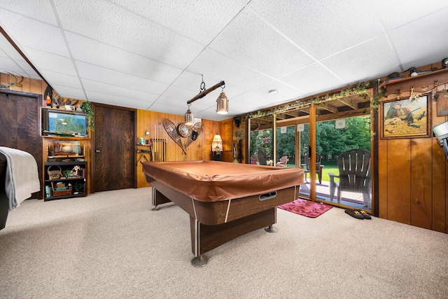 game room featuring a paneled ceiling, carpet floors, billiards, and wood walls