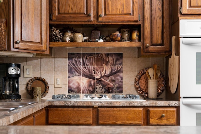 interior details featuring white appliances and tasteful backsplash