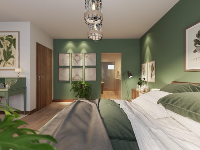 bedroom with ensuite bath and hardwood / wood-style flooring