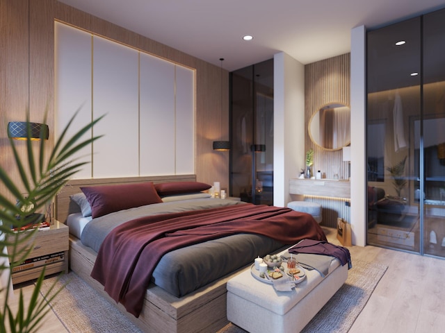 bedroom with radiator and light hardwood / wood-style floors