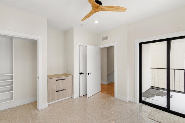 unfurnished bedroom featuring ceiling fan