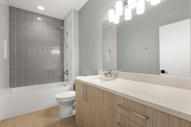 full bathroom with vanity, toilet, tiled shower / bath combo, and tile patterned flooring