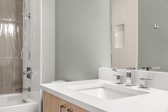 full bathroom featuring vanity, toilet, and shower / bathing tub combination