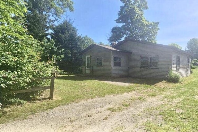 exterior space featuring a front lawn