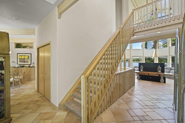 stairway with a towering ceiling