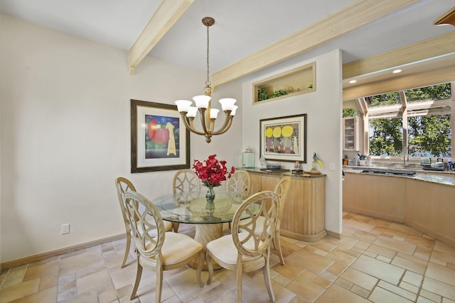 dining space with beamed ceiling and a chandelier