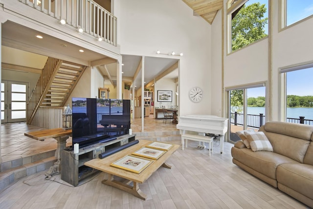 living room with a high ceiling and french doors