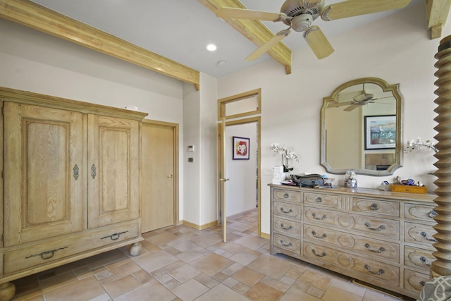 interior space featuring beamed ceiling and ceiling fan