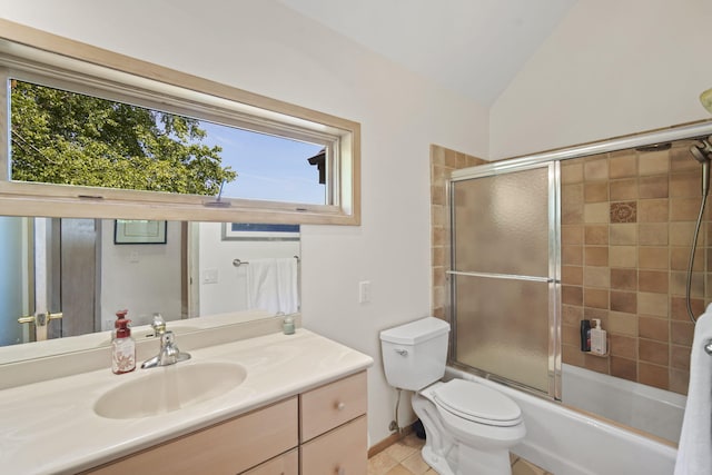 full bathroom featuring vanity, combined bath / shower with glass door, a healthy amount of sunlight, and toilet