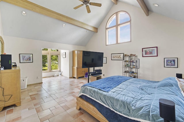 bedroom with ceiling fan, high vaulted ceiling, and beamed ceiling