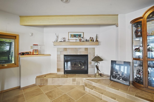 unfurnished living room with beam ceiling and a fireplace