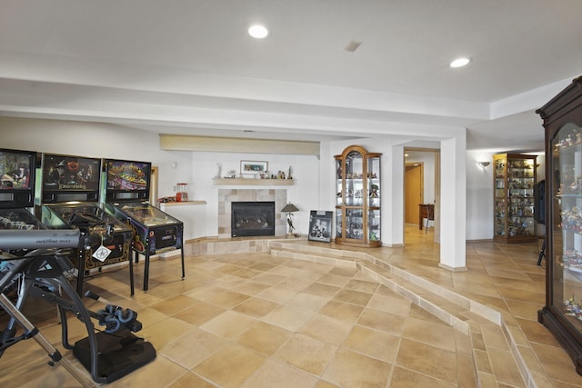 exercise room featuring tile patterned flooring and a tile fireplace