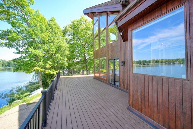 wooden terrace with a water view