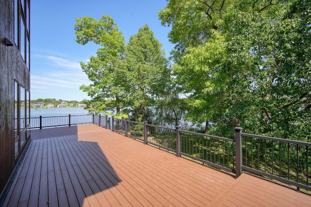 wooden terrace featuring a water view