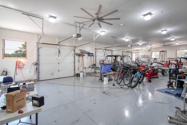 garage featuring a garage door opener and ceiling fan