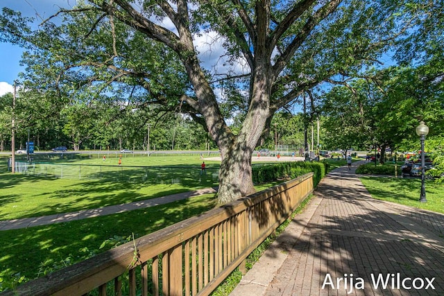 view of property's community with a lawn