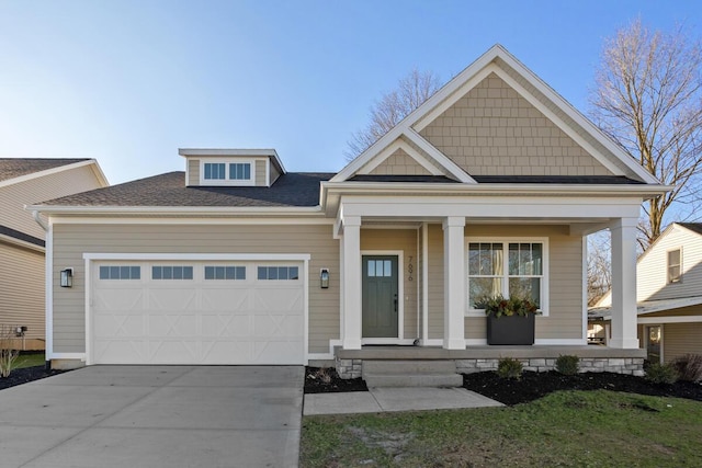 craftsman inspired home featuring a porch and a garage