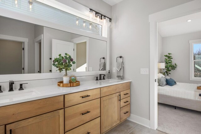 bathroom featuring tile patterned flooring and vanity