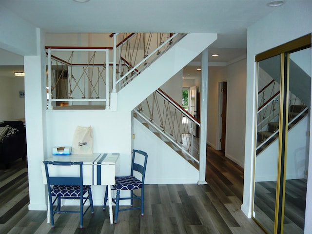 stairs with hardwood / wood-style floors