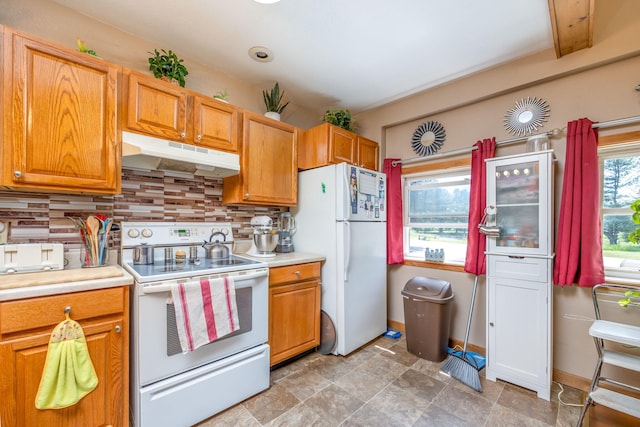 kitchen featuring tasteful backsplash, white appliances, and beamed ceiling