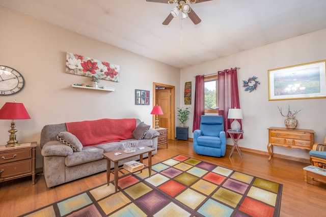 living room with hardwood / wood-style flooring and ceiling fan