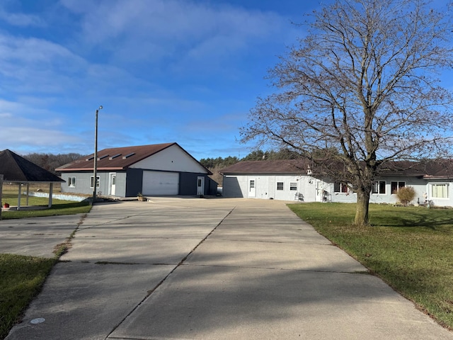 view of front facade with a garage and a front lawn