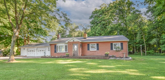 single story home with a garage and a front yard