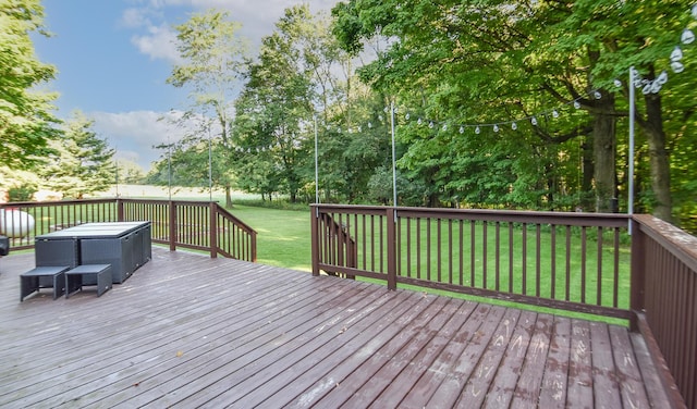 deck featuring a lawn