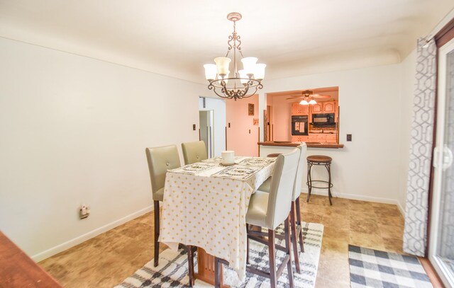 dining area featuring an inviting chandelier