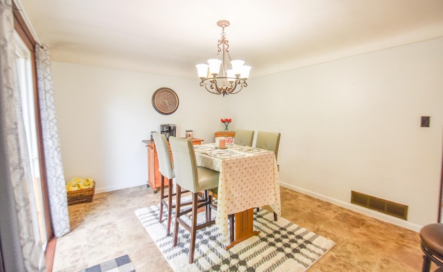 dining room with a chandelier