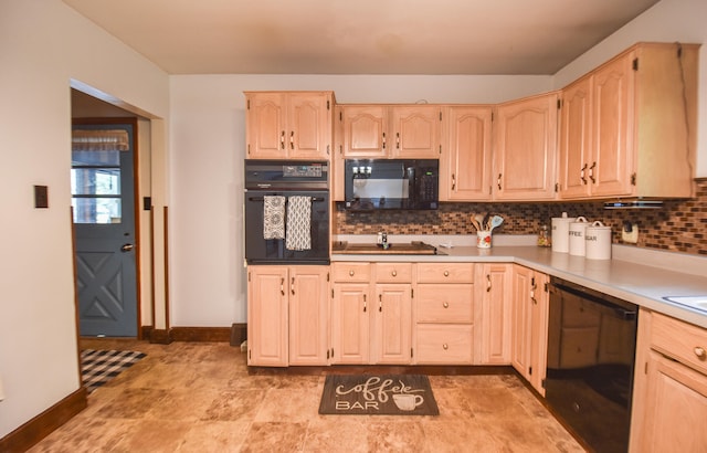 kitchen with backsplash, light brown cabinetry, and black appliances