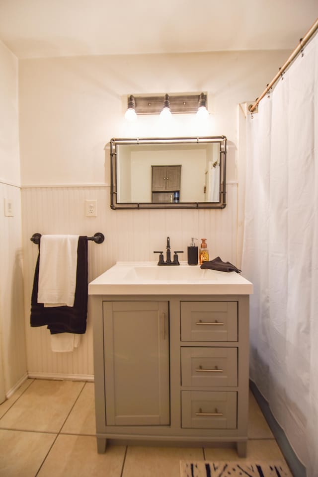 bathroom featuring tile patterned flooring and vanity