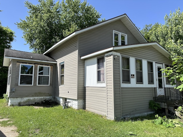 view of home's exterior featuring a yard