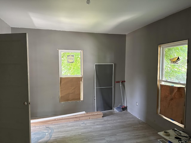 spare room with light hardwood / wood-style flooring