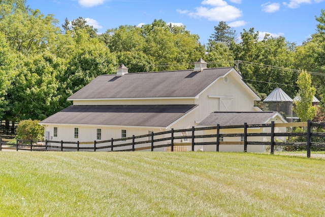 view of home's exterior featuring a yard