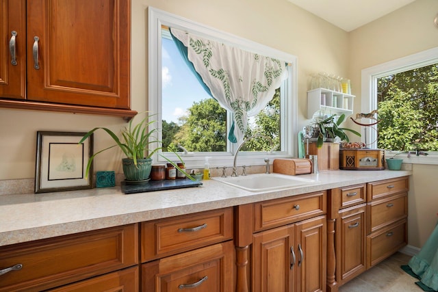 kitchen with sink and light tile patterned floors