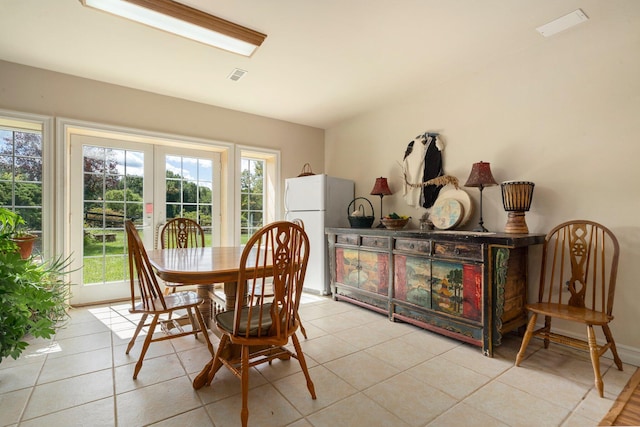 dining area featuring light tile patterned floors