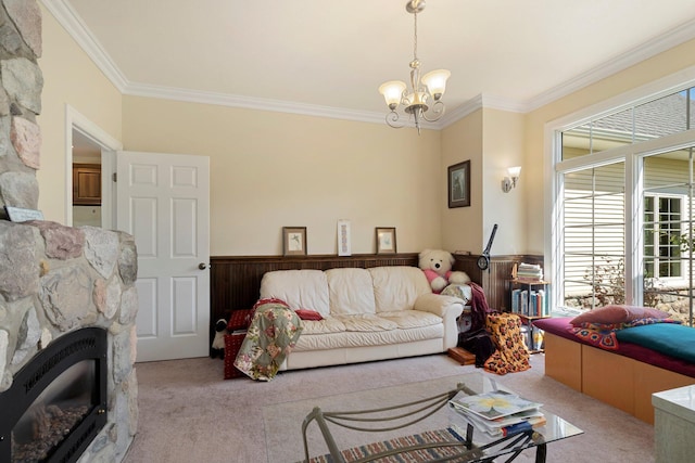 carpeted living room featuring crown molding, a notable chandelier, and a fireplace