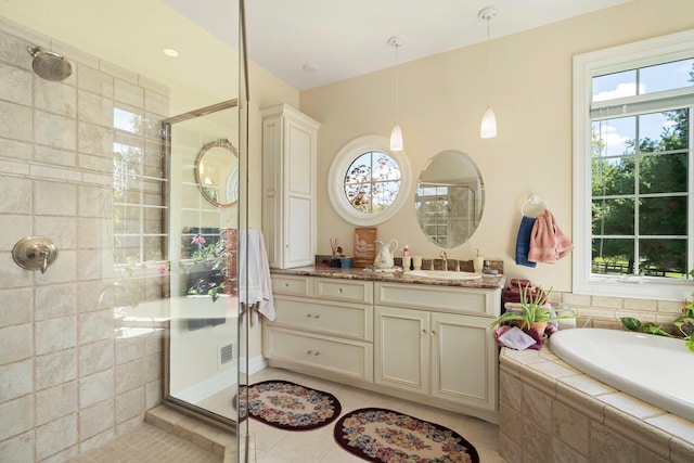 bathroom with vanity, separate shower and tub, and tile patterned floors