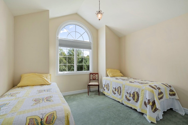 carpeted bedroom featuring lofted ceiling